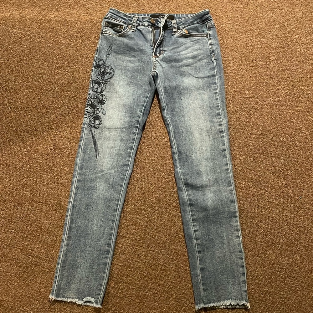 Joe’s Jeans for kids in a medium wash denim with a navy flower pattern on leg!